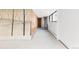 Finished basement with unique wall art and access to the outside at 7170 W 8Th Pl, Lakewood, CO 80214