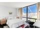 Bedroom featuring a large window with great view and stylish decor at 7170 W 8Th Pl, Lakewood, CO 80214