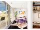 Stylish dining room boasts glass table, purple chairs, and deck access for seamless indoor/outdoor living at 7170 W 8Th Pl, Lakewood, CO 80214
