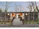 Contemporary home with unique wood siding and mature landscaping at 7170 W 8Th Pl, Lakewood, CO 80214