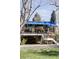 Exterior of home with wooden deck and stairs at 7170 W 8Th Pl, Lakewood, CO 80214