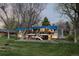 Charming home featuring blue awnings, a spacious deck, and a well-manicured lawn for outdoor enjoyment at 7170 W 8Th Pl, Lakewood, CO 80214