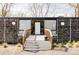 Striking modern home featuring a unique facade with inviting wood deck, adding character to the exterior at 7170 W 8Th Pl, Lakewood, CO 80214