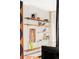 Artistic shelving displays decor in this living space featuring a wood burning stove, offering modern style at 7170 W 8Th Pl, Lakewood, CO 80214