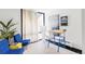 Inviting living room with stylish furniture, large windows, and modern art at 7170 W 8Th Pl, Lakewood, CO 80214