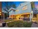 Spacious backyard at twilight with patio, outdoor kitchen, and comfortable seating areas at 11 S Albion St, Denver, CO 80246
