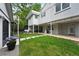 Inviting backyard with lush lawn, patio, and outdoor kitchen perfect for entertaining at 11 S Albion St, Denver, CO 80246