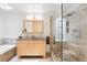Modern bathroom featuring double sinks, a glass-enclosed shower, and tile accents, creating a spa-like experience at 11 S Albion St, Denver, CO 80246