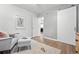 Bright bedroom with modern decor, hardwood floors, and sliding door entrance at 11 S Albion St, Denver, CO 80246
