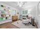 Cozy Bedroom featuring hardwood floors, playful shelving, and a comfortable seating area, creating a warm space at 11 S Albion St, Denver, CO 80246