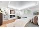 Serene bedroom featuring a fireplace, built-in shelving, and modern lighting for a cozy and stylish ambiance at 11 S Albion St, Denver, CO 80246