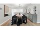 Dining room area with hardwood floors, contemporary light fixture and convenient wine storage at 11 S Albion St, Denver, CO 80246