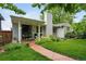 Charming home with covered porch, pathway, and vibrant landscaping at 11 S Albion St, Denver, CO 80246