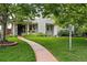 Inviting home with lush front lawn and decorative sidewalk at 11 S Albion St, Denver, CO 80246