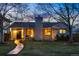 Charming home features a lighted walkway and a cozy front yard with mature trees and landscaping at 11 S Albion St, Denver, CO 80246