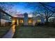 Charming home exterior at twilight with well-maintained lawn, landscaped yard and inviting walkway to the front door at 11 S Albion St, Denver, CO 80246