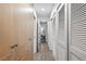 Hallway with wood floors and ample closet space that leads into another room at 11 S Albion St, Denver, CO 80246