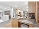 Well-designed kitchen features stainless appliances, light cabinets, and a built-in workstation at 11 S Albion St, Denver, CO 80246