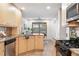 Bright kitchen area featuring stainless steel appliances, light cabinets, and an eat-in space at 11 S Albion St, Denver, CO 80246