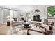 Stylishly decorated living room with fireplace and sliding barn door at 11 S Albion St, Denver, CO 80246