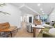 Open-concept living room with modern furniture, a wet bar, and sliding glass doors to the outdoor patio at 11 S Albion St, Denver, CO 80246