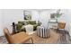 Cozy living room showcasing stylish furniture, artwork, and natural light, with a rug defining the seating area at 11 S Albion St, Denver, CO 80246