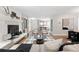Bright living room featuring a white brick fireplace and hearth with an area rug and a modern sofa at 11 S Albion St, Denver, CO 80246