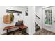 Mud room featuring hardwood floors, bench, storage hooks, and a view to outside at 11 S Albion St, Denver, CO 80246