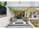 Covered patio with comfortable seating, dining area, and outdoor kitchen for relaxed outdoor living at 11 S Albion St, Denver, CO 80246