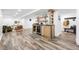 Spacious recreational room with a modern wet bar, and comfortable living room area for entertaining and relaxing at 11 S Albion St, Denver, CO 80246