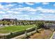 Expansive aerial view of lush park, cityscape, and distant mountains under a bright blue sky at 1401 Wewatta St # 709, Denver, CO 80202