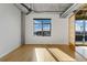 Bright bedroom with downtown views, hardwood floors, and ample natural light at 1401 Wewatta St # 709, Denver, CO 80202