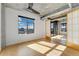 Bright bedroom with downtown views, hardwood floors, and a modern ceiling fan at 1401 Wewatta St # 709, Denver, CO 80202