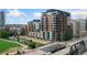 Apartment building with brick facade and balconies near a river and city streets at 1401 Wewatta St # 709, Denver, CO 80202