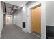 Well-lit hallway with modern design elements and neutral color palette at 1401 Wewatta St # 709, Denver, CO 80202