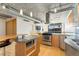 Bright kitchen with stainless steel appliances, granite countertops, and island at 1401 Wewatta St # 709, Denver, CO 80202