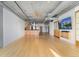 Open concept living room with modern lighting and hardwood floors throughout at 1401 Wewatta St # 709, Denver, CO 80202