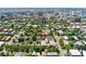 Wide aerial shot displays this home's location surrounded by mature trees and accessible city amenities at 1154 N Clarkson St, Denver, CO 80218