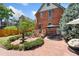 Spacious backyard with a seating area, dining table, a water fountain, and lush plants at 1154 N Clarkson St, Denver, CO 80218