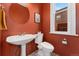 Cozy bathroom with bold paint, vintage fixtures, pedestal sink, and unique design elements at 1154 N Clarkson St, Denver, CO 80218
