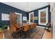 Dining room showcasing a wood table, leather chairs, natural light from windows, and a patterned rug at 1154 N Clarkson St, Denver, CO 80218