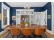 Elegant dining room featuring a wood table, leather chairs, a chandelier, and built-in storage at 1154 N Clarkson St, Denver, CO 80218