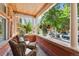 Relaxing front porch featuring comfortable seating and hanging plants, perfect for enjoying the outdoors at 1154 N Clarkson St, Denver, CO 80218
