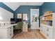 Comfortable and tidy home office featuring a white desk, chair, and hardwood floors at 1154 N Clarkson St, Denver, CO 80218