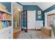 Bright home office with an open glass door to an entry way and hardwood floors at 1154 N Clarkson St, Denver, CO 80218