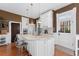 Charming kitchen featuring a center island, granite countertops, stainless steel appliances, and hardwood floors at 1154 N Clarkson St, Denver, CO 80218