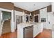 Bright kitchen with a large island, stainless steel appliances, and ample cabinet space at 1154 N Clarkson St, Denver, CO 80218