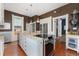 Spacious kitchen with a center island, granite countertops, modern appliances, and hardwood floors at 1154 N Clarkson St, Denver, CO 80218