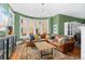 Bright and airy living room with a bay window, hardwood floors, and comfortable sectional sofa at 1154 N Clarkson St, Denver, CO 80218