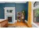 Elegant bedroom featuring a fireplace, hardwood floors, and a window with stained glass at 1154 N Clarkson St, Denver, CO 80218
